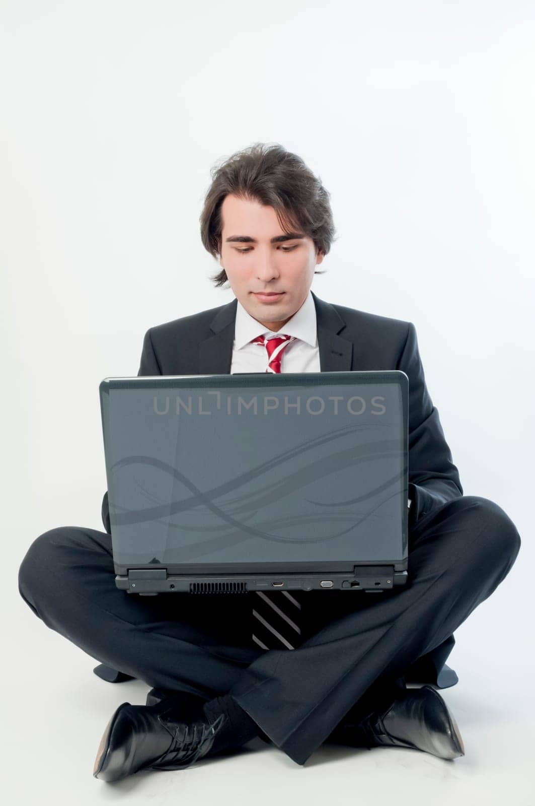 Young man browsing on a notebook