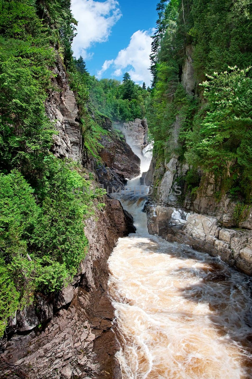 Canyon Sainte-Anne in St-Joachim, Quebec, Canada near Ste-Anne de Beaupre. A 74 meter high waterfall is rumbling into a small canyon.