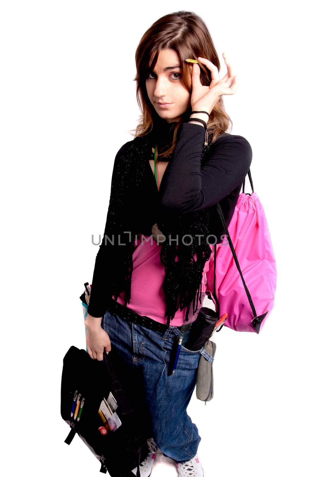 View of a teenager school girl with school stuff on a white background.
