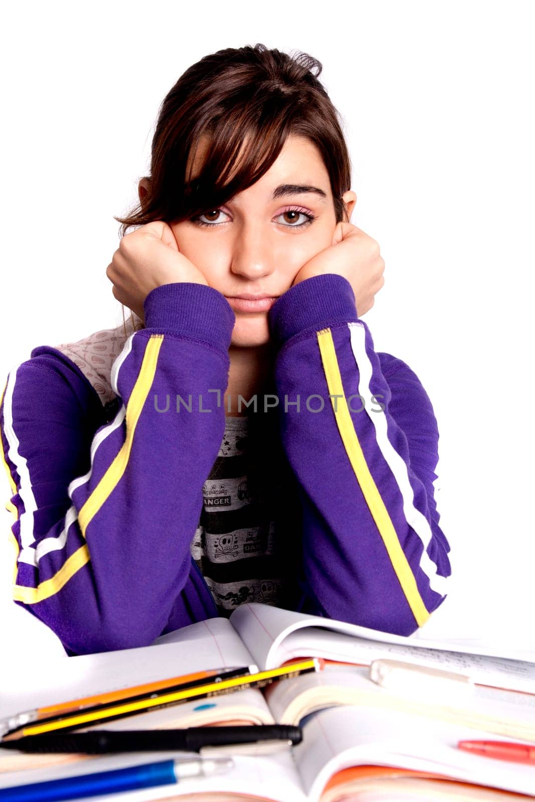 View of a teenager school girl looking at the camera with an upset expression.