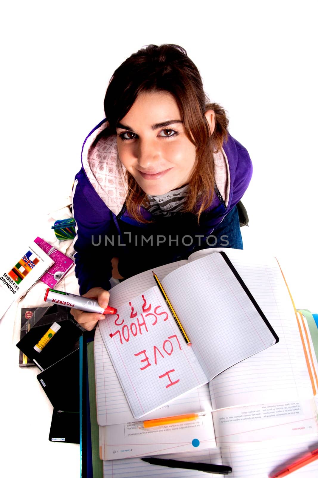 View of a teenager school girl looking at the camera with a smile.