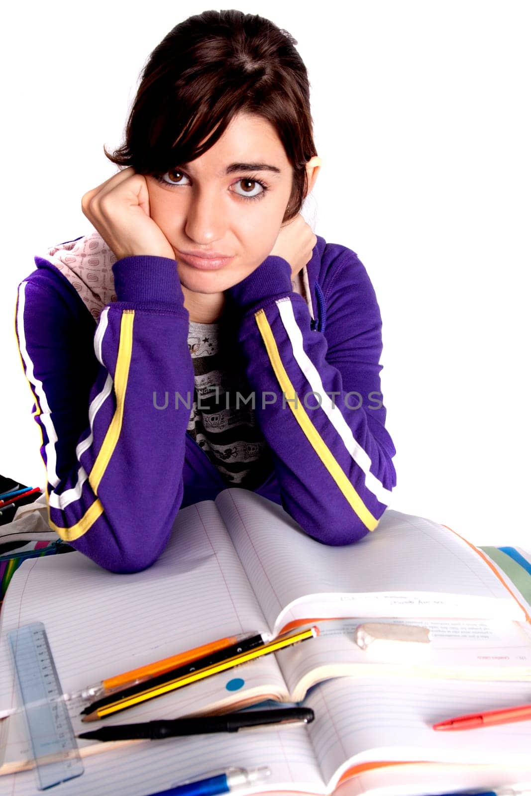 View of a teenager school girl looking at the camera with an upset expression.