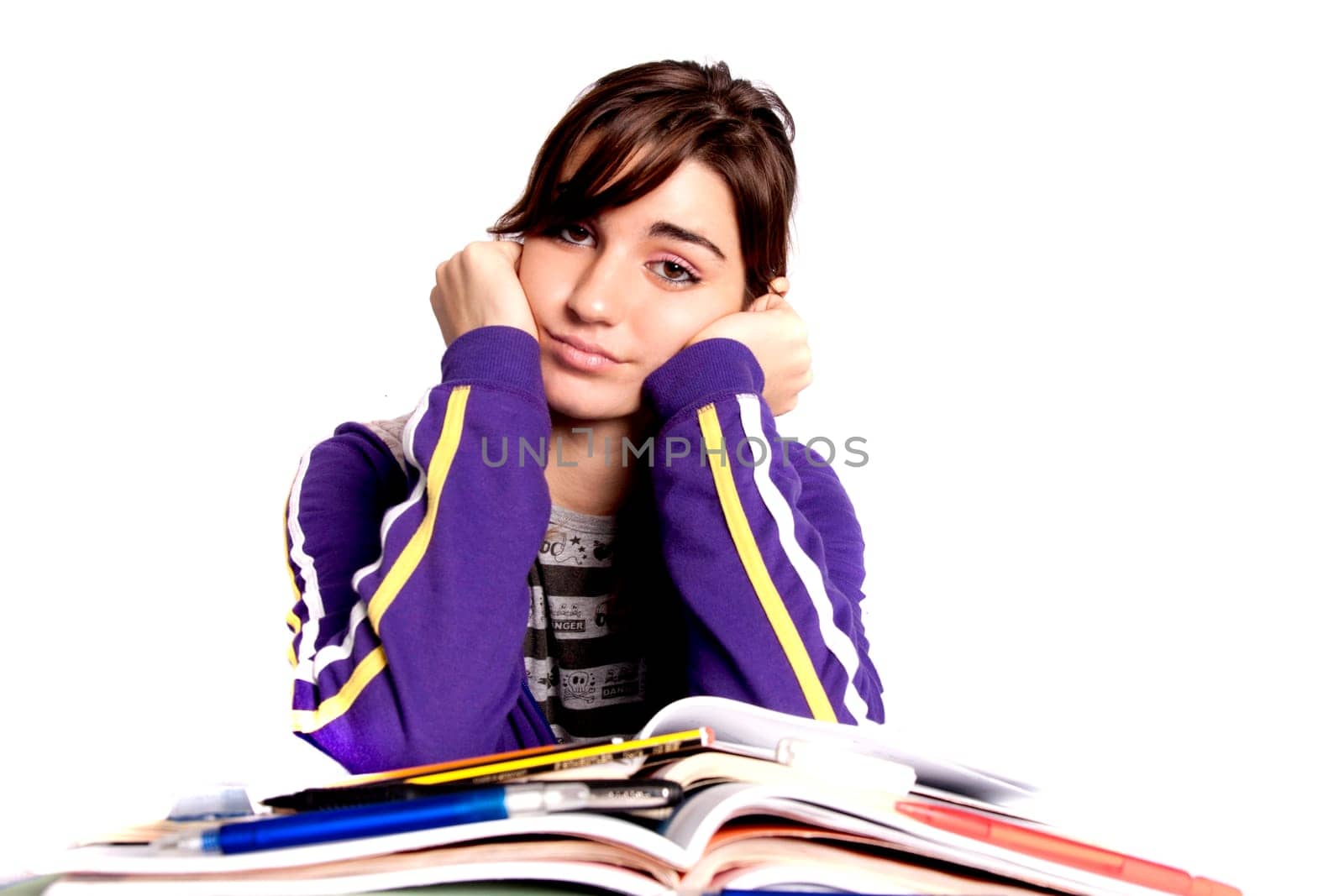 View of a teenager school girl looking at the camera with an upset expression.