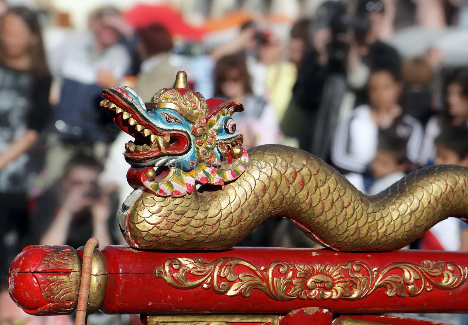 Detail statue Chinese dragon with people background