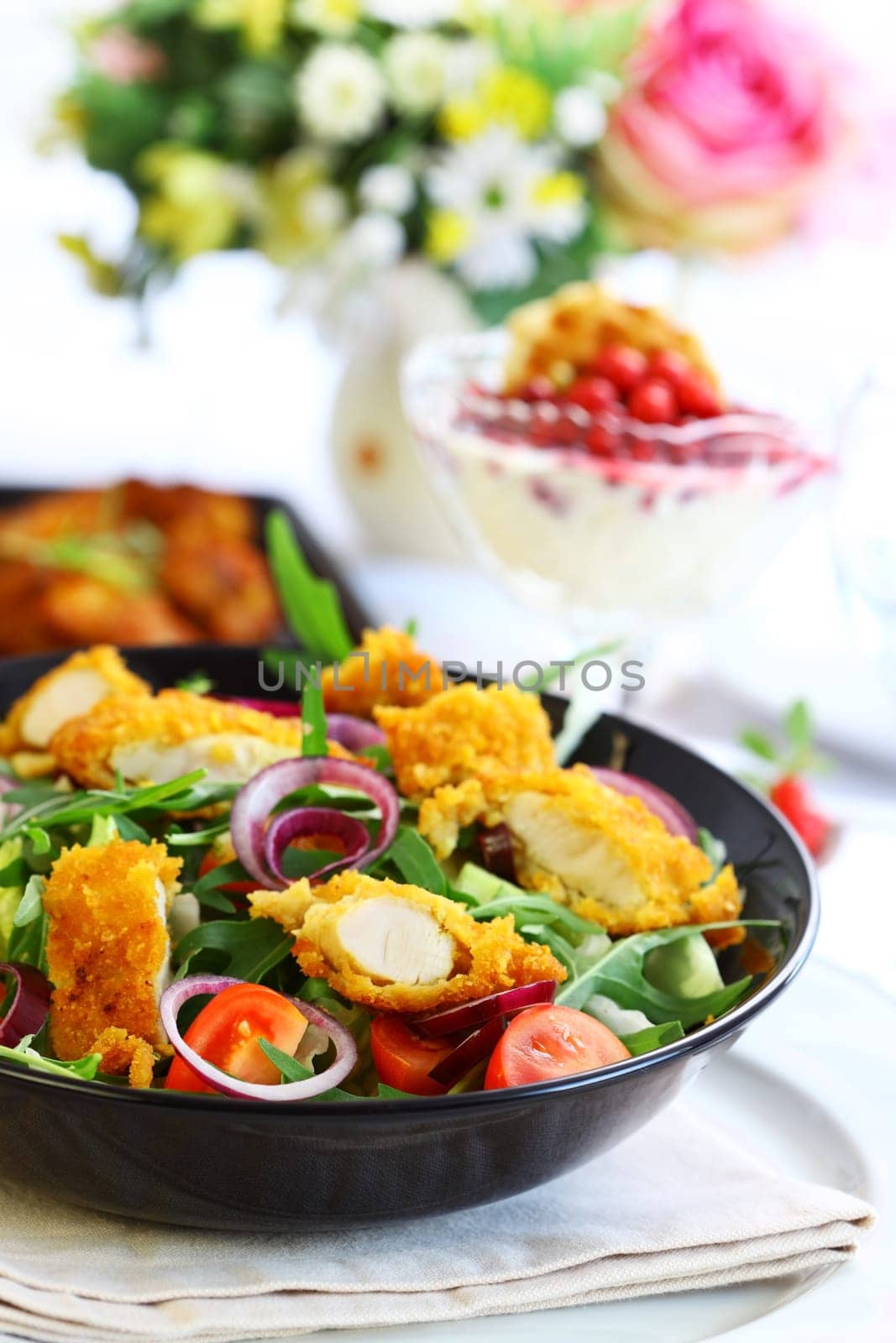 Big gourmet salad with mixed vegetable and curry chicken stripes