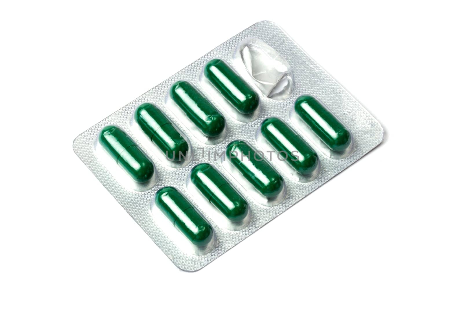 Green capsules packed in blister