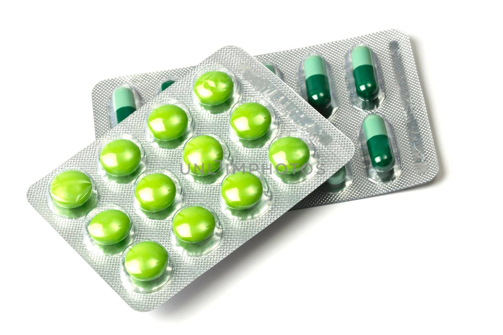 Green capsules packed in blister