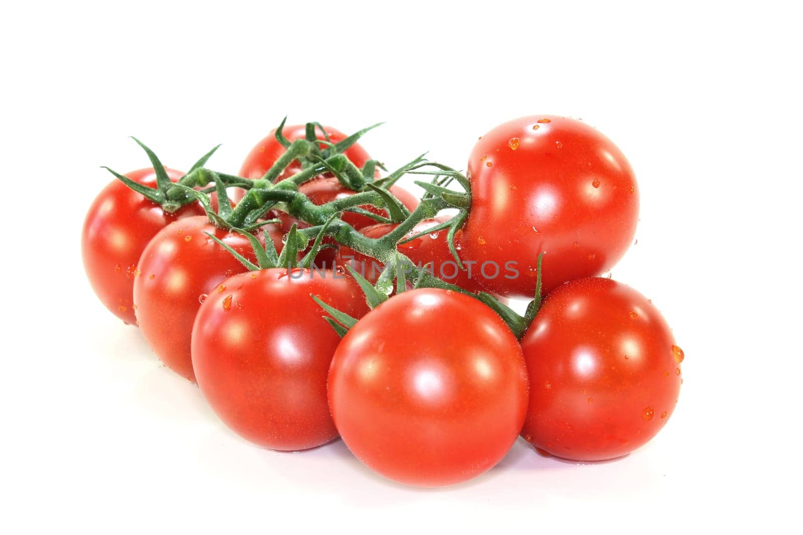 a bunch of vine tomatoes against a white background