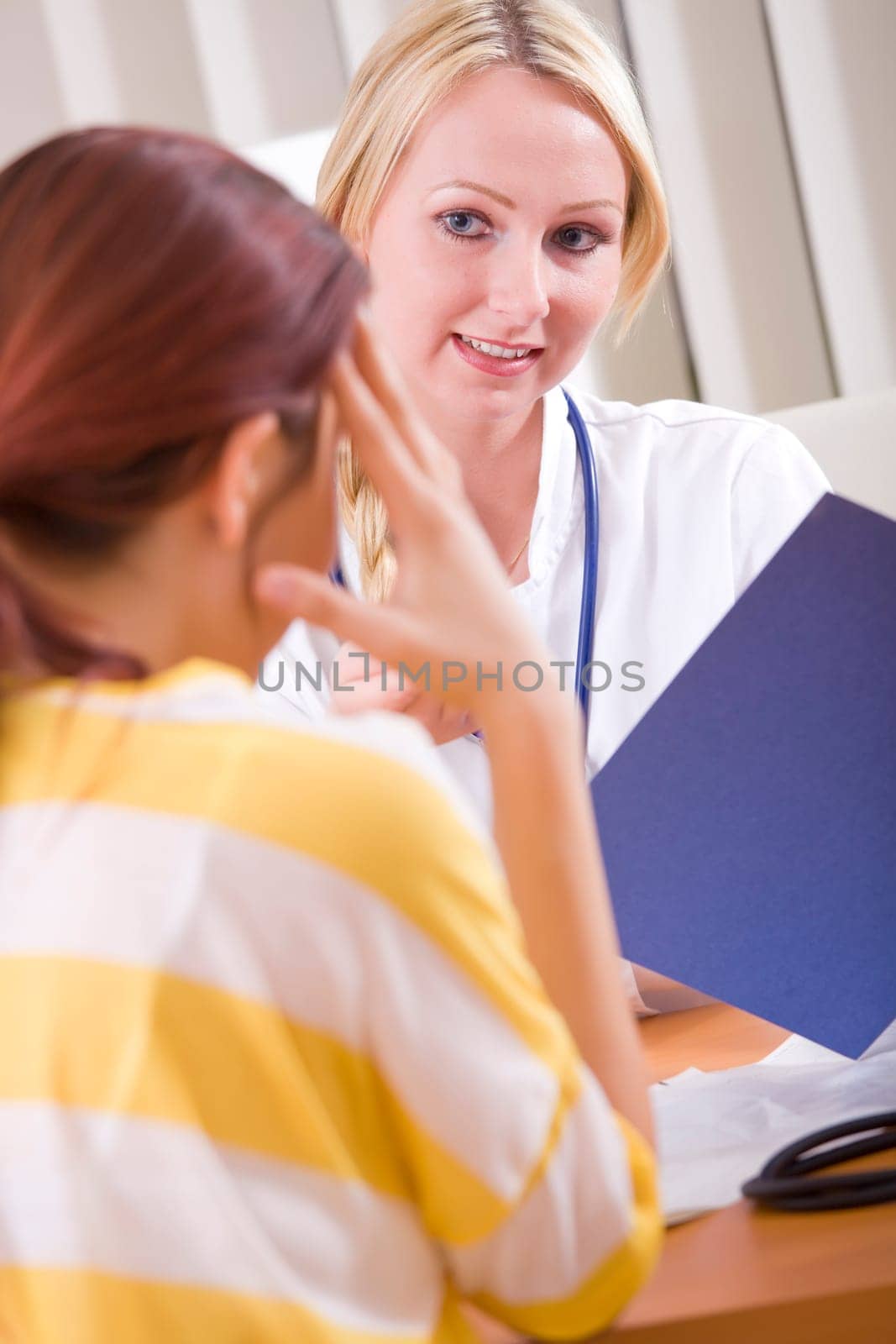 doctor and patient in friendly talk in office