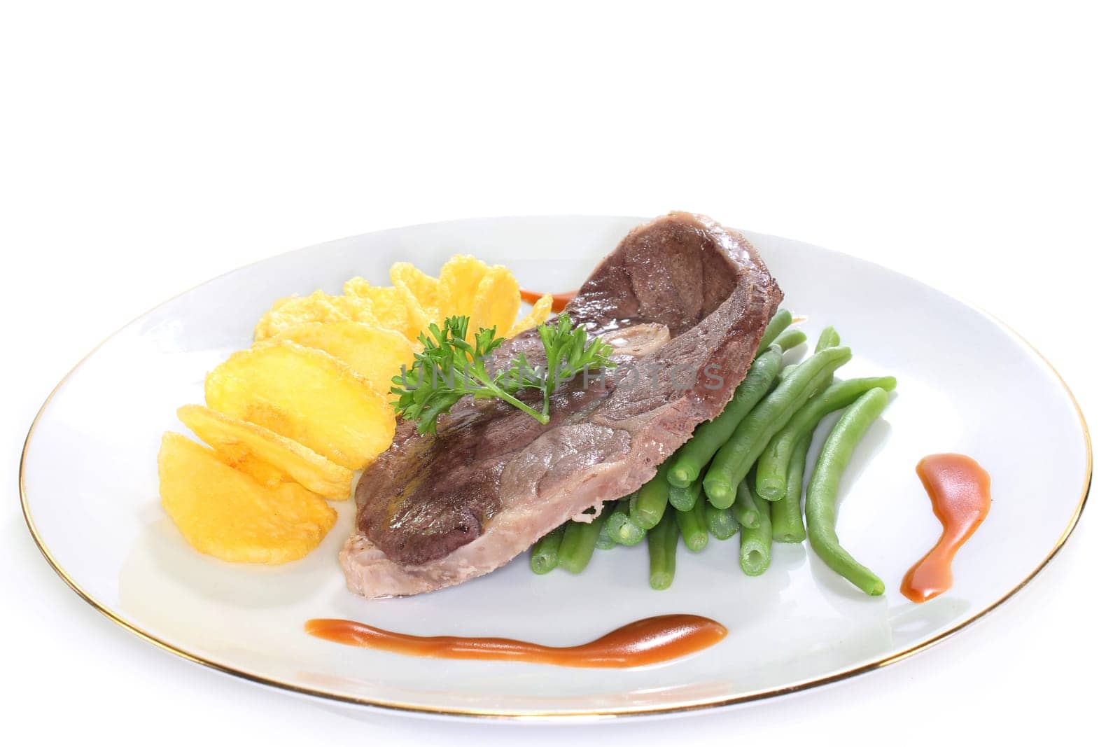 a slice of lamb leg with green beans