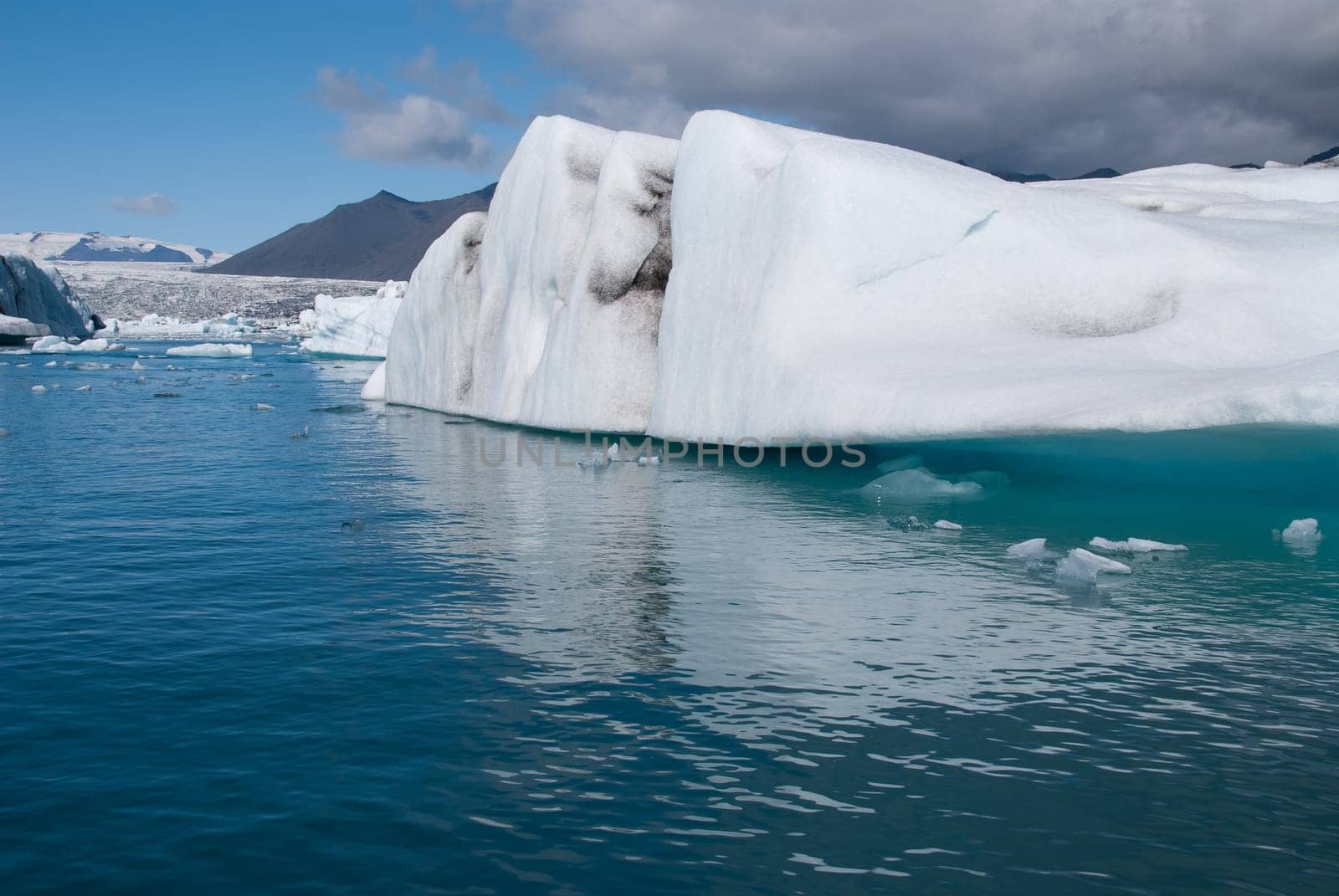 mountains and icebergs on the lake in Iceland Jokulsarlon