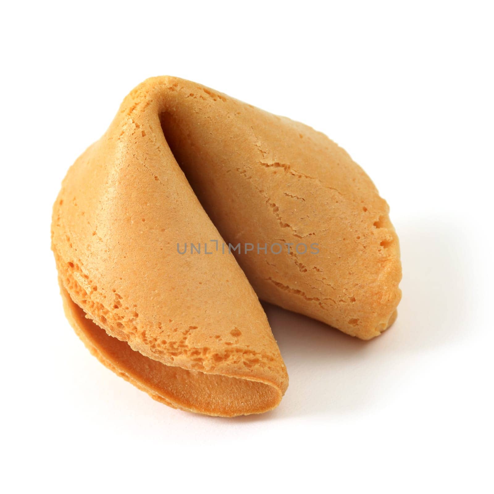 Photo of an isolated fortune cookie on a white background.