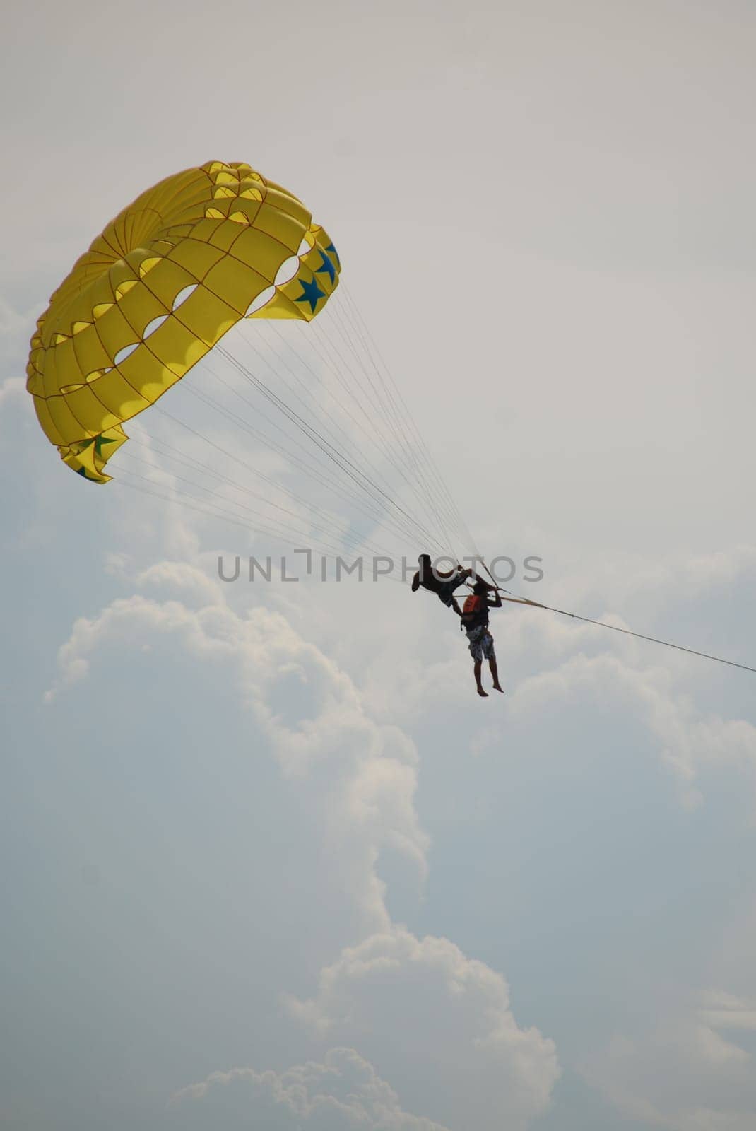 Open-air acrobats in parachute