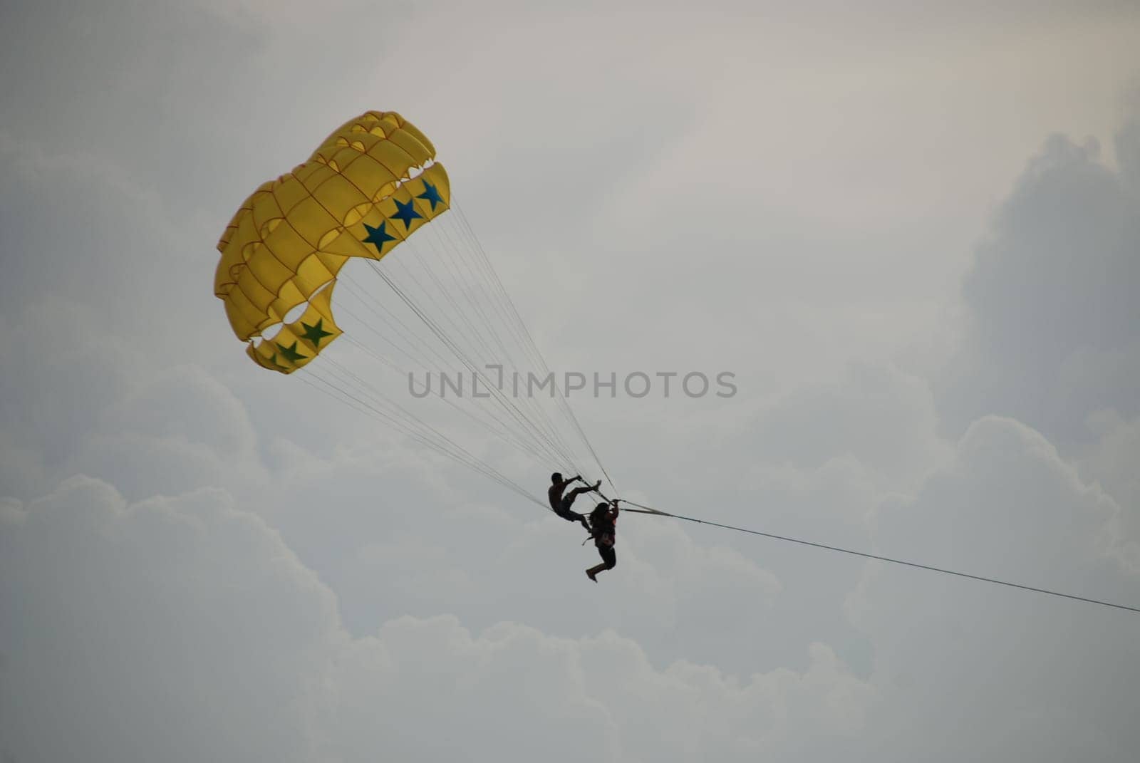 Open-air acrobats in parachute