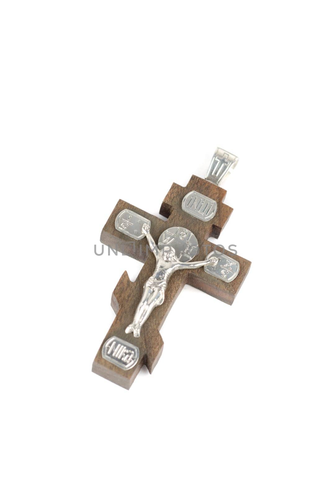 silver and wooden cross with religious inscriptions isolated on a white