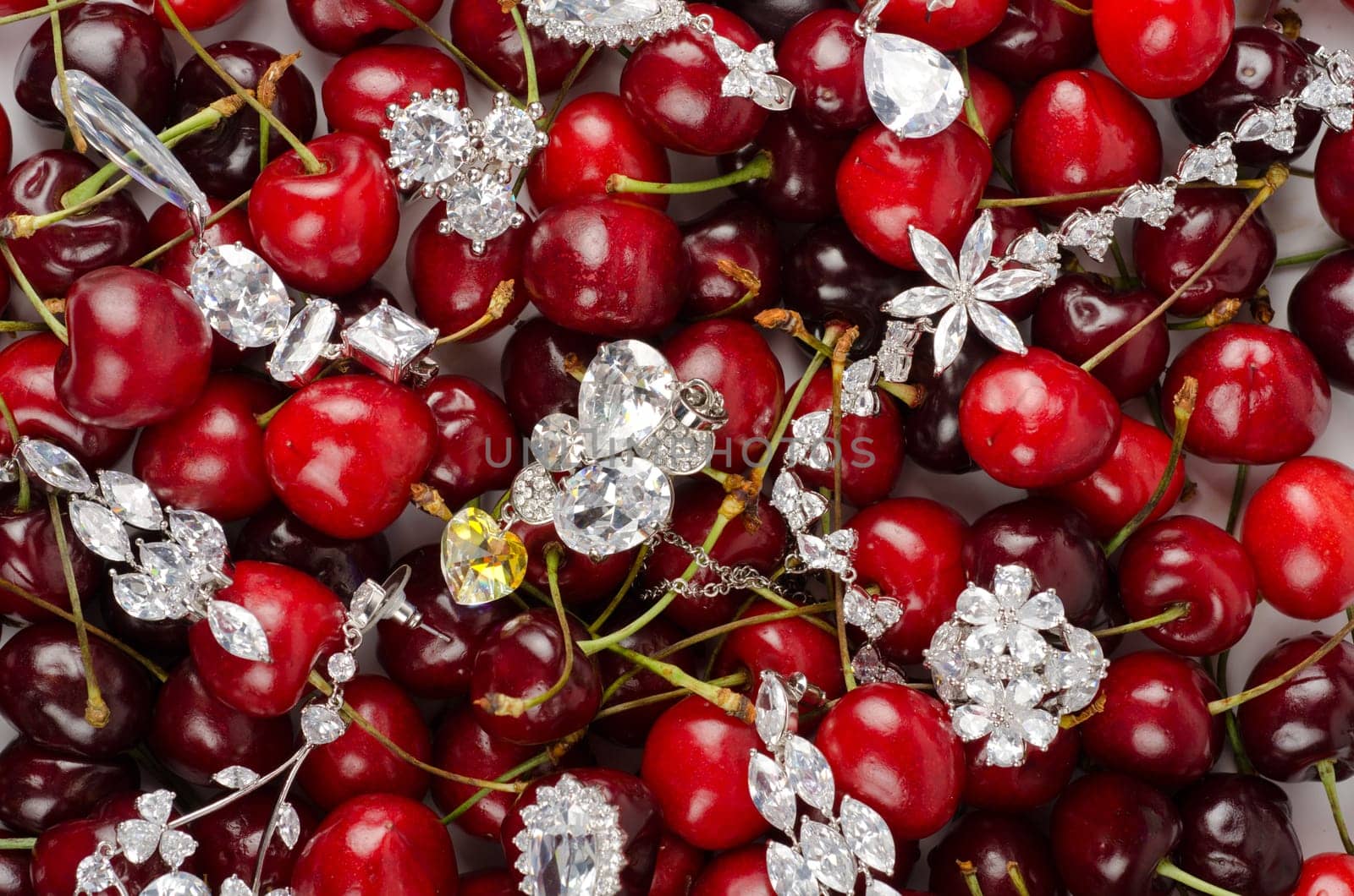 Jewels at fruit red ripe cherries berry background