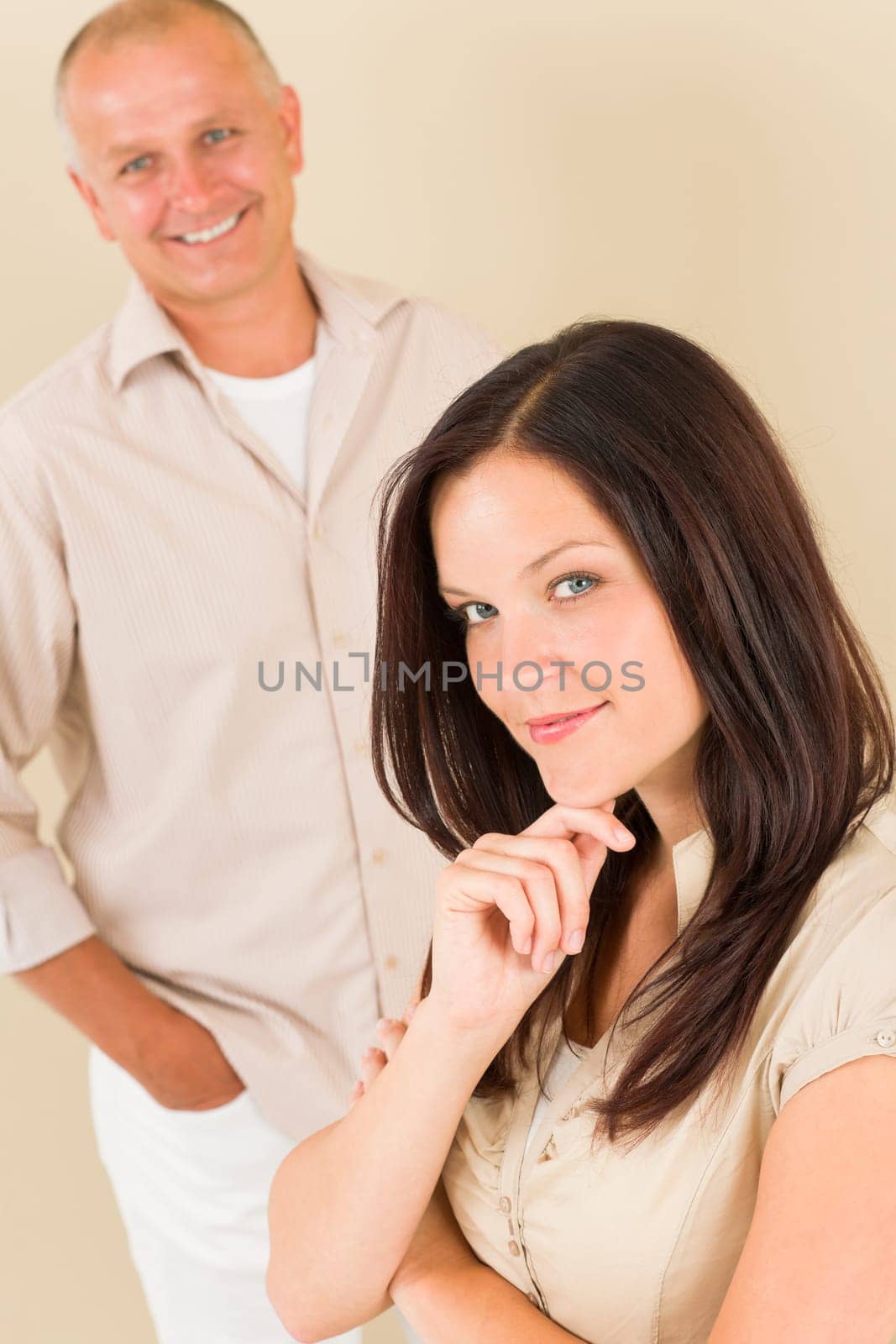 Casual businesswoman attractive thoughtful smiling with businessman colleague