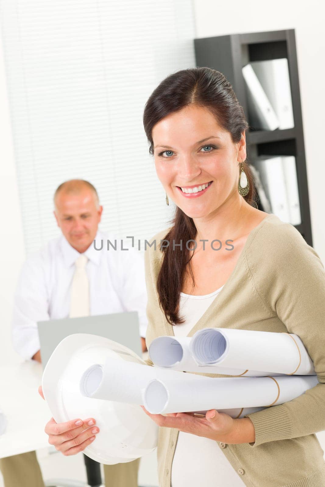 Professional architect woman attractive with blueprint in office