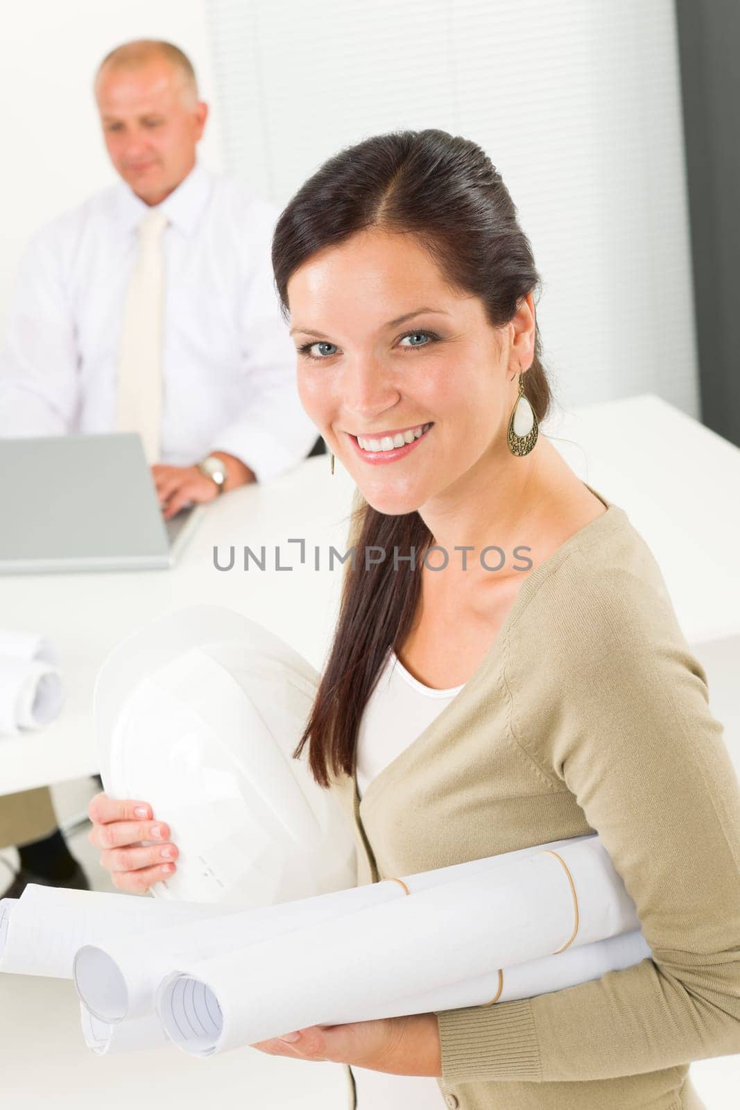 Professional architect woman attractive with blueprint in office