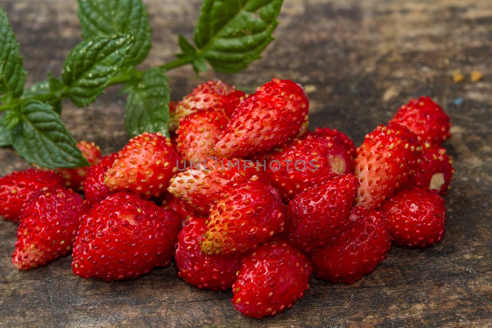 fresh Wild strawberries on wooden background