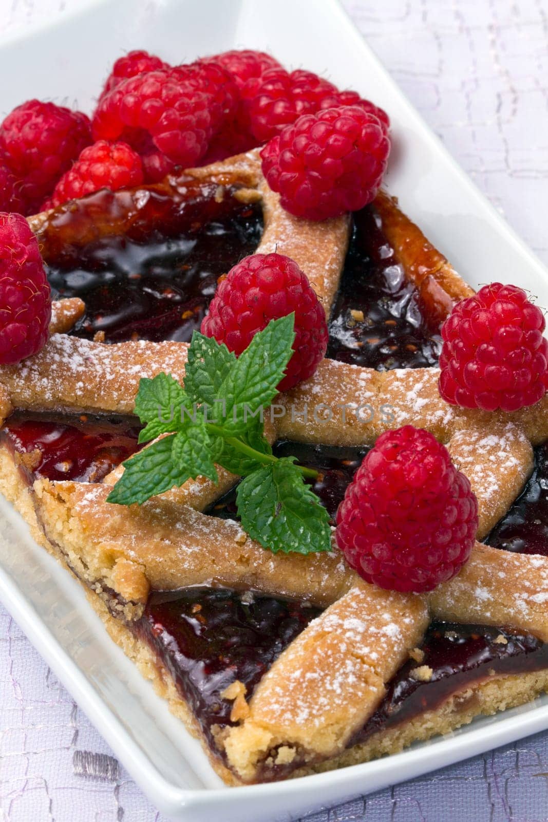 a raspberries tart with fresh fruits