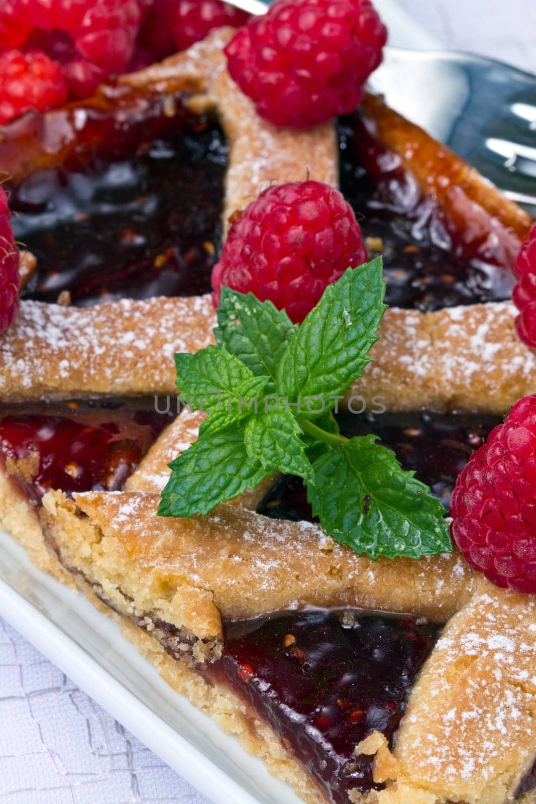 a raspberries tart with fresh fruits