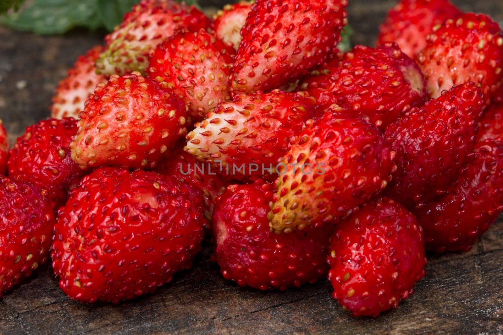 fresh Wild strawberries on wooden background