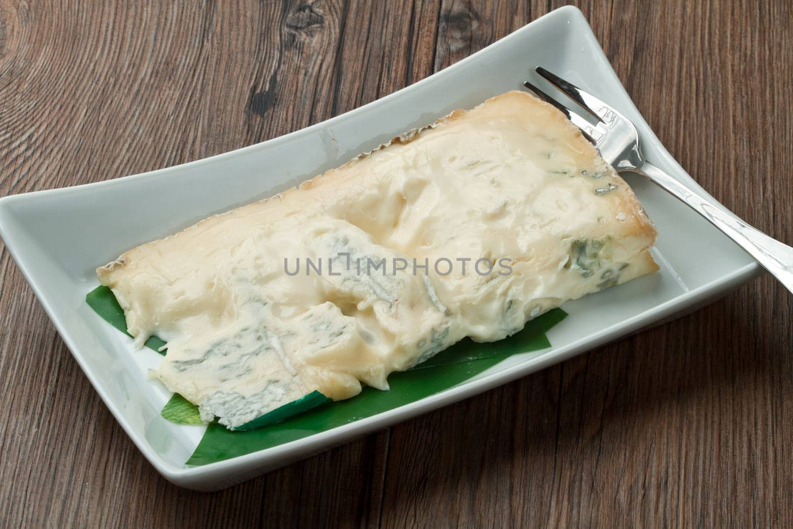 blue cheese on wooden background