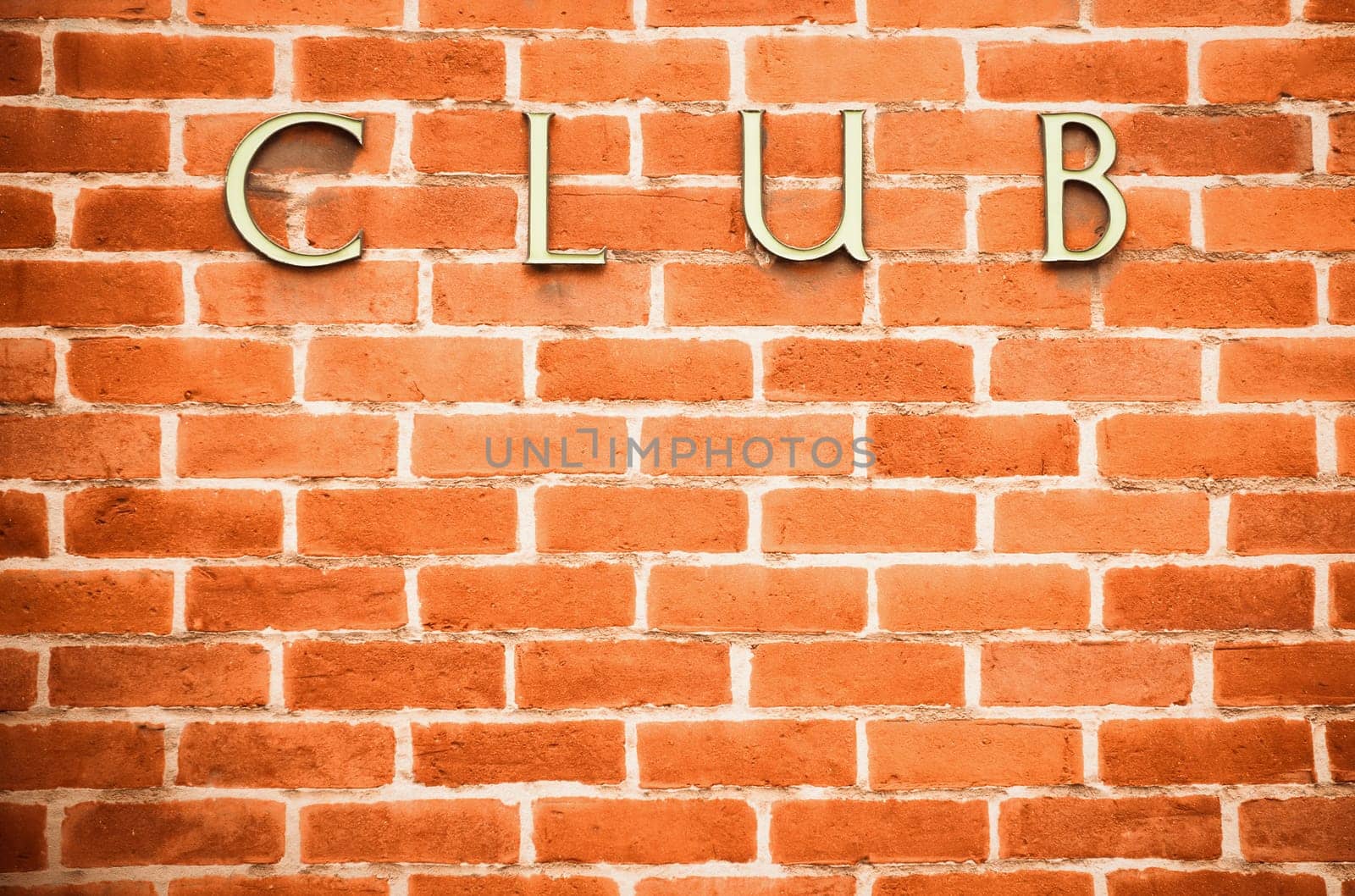 red brick wall vignette background featuring club sign