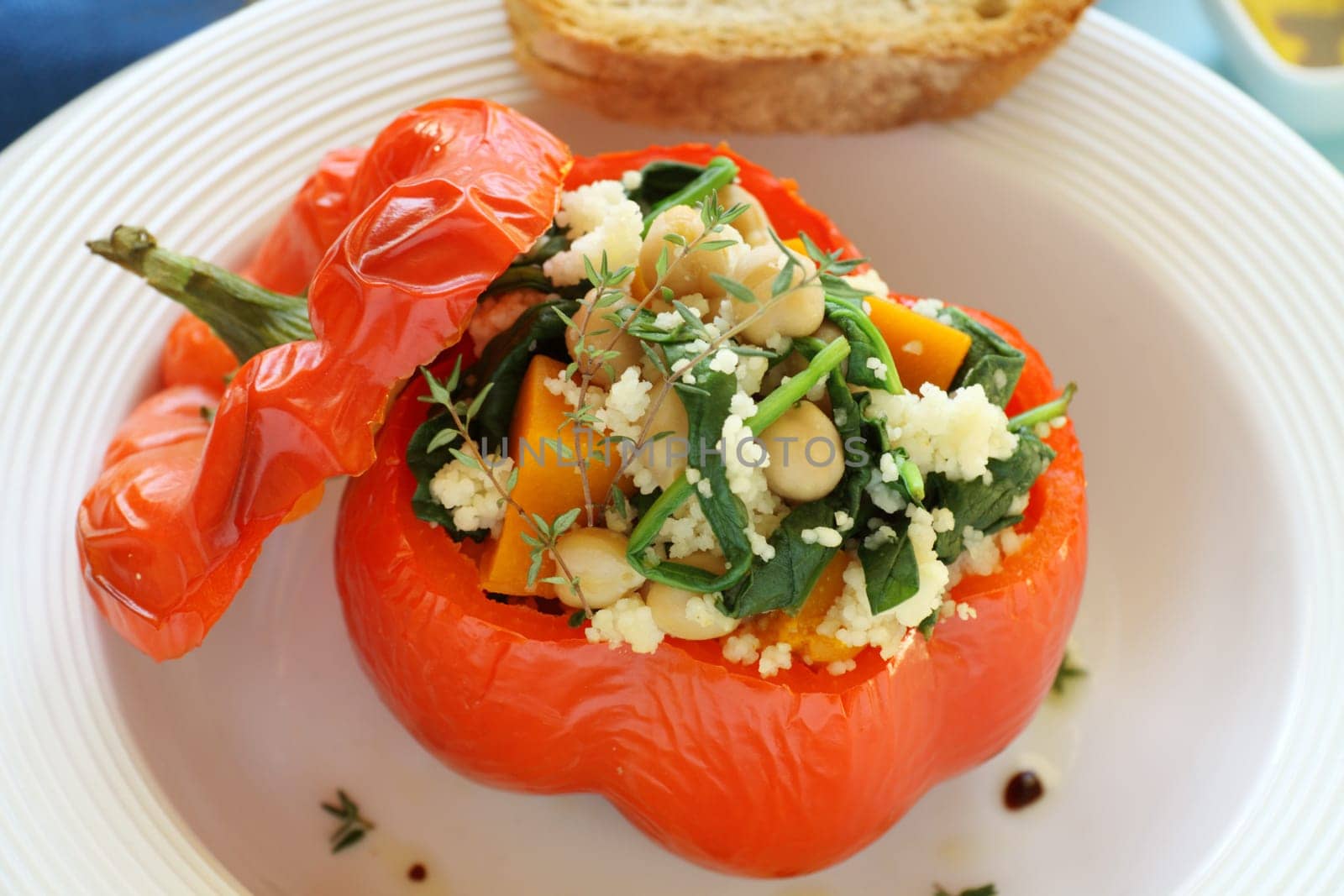 Roasted capsicum stuffed with cous cous, chick peas, spinach and pumpkin.