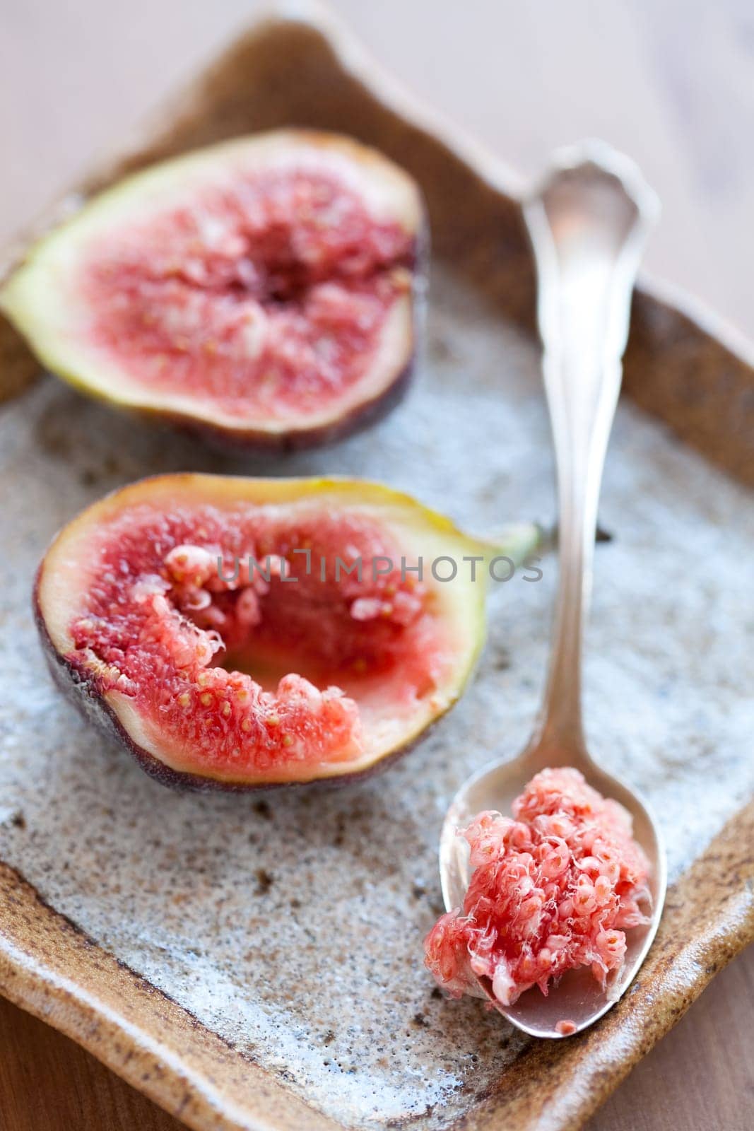Delicious, fresh and ripe fig halves. Studio shot.
