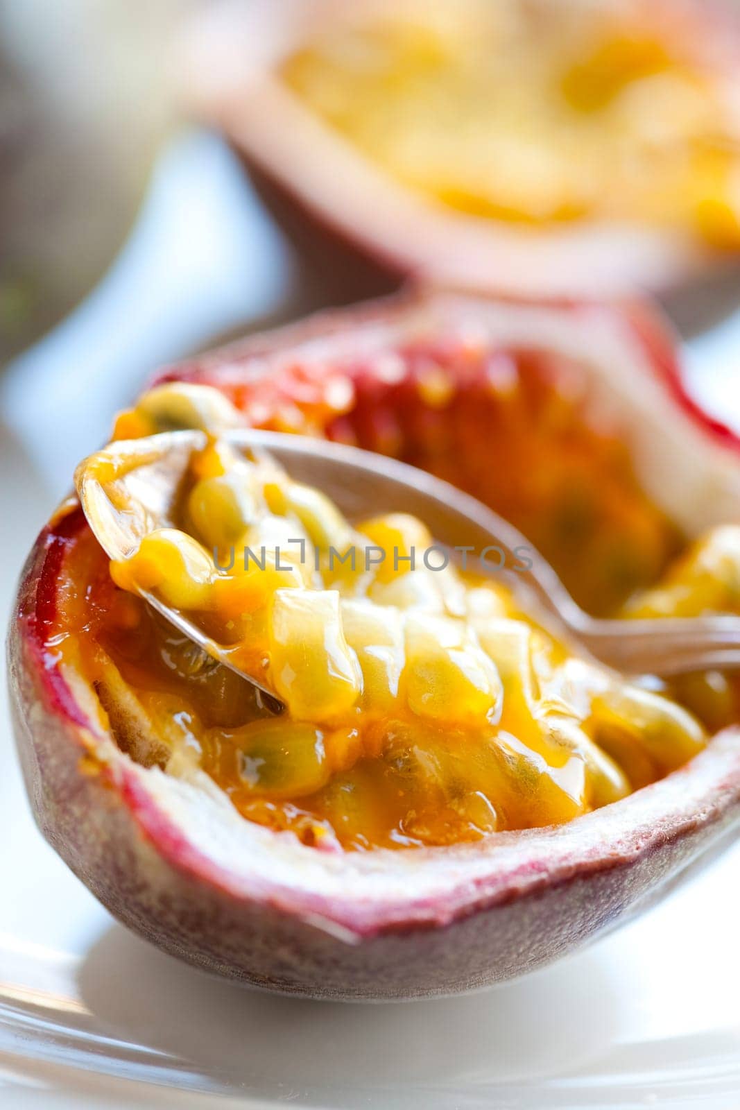 Delicious fresh passion fruit halves. Studio shot.