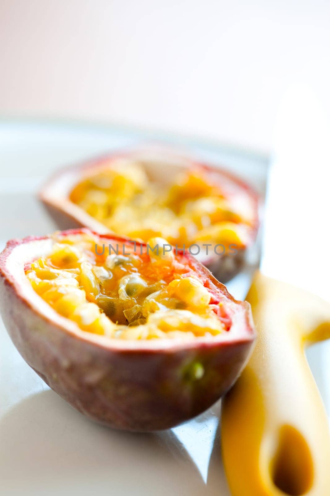 Delicious fresh passion fruit halves. Studio shot.
