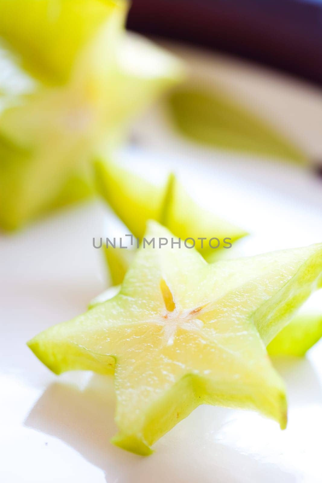 Slices of fresh and delicious Carambola fruit. Studio shot.