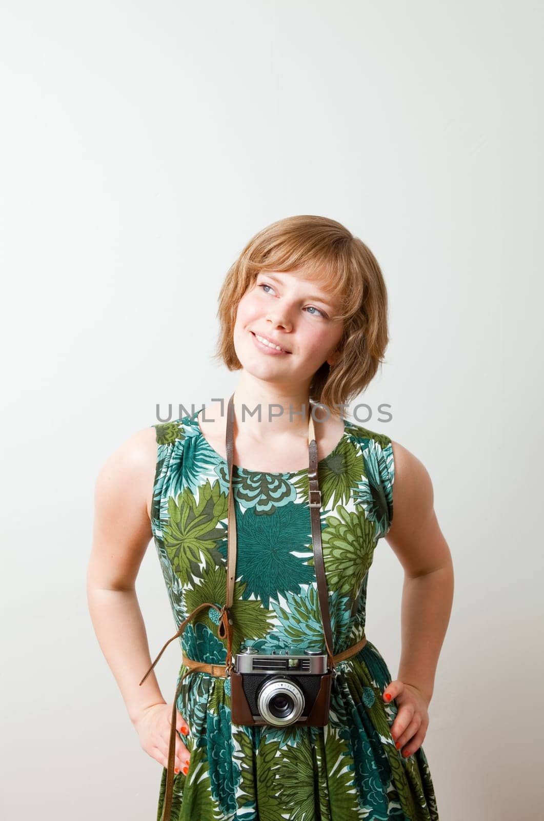 Young woman with an old vintage camera