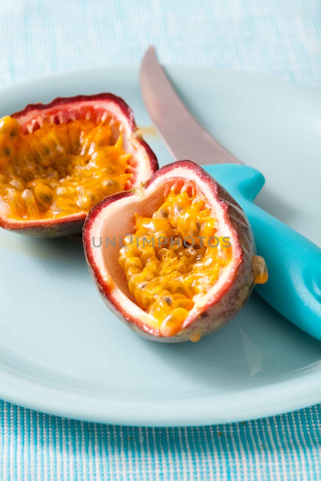 Delicious fresh passion fruit halves. Studio shot.