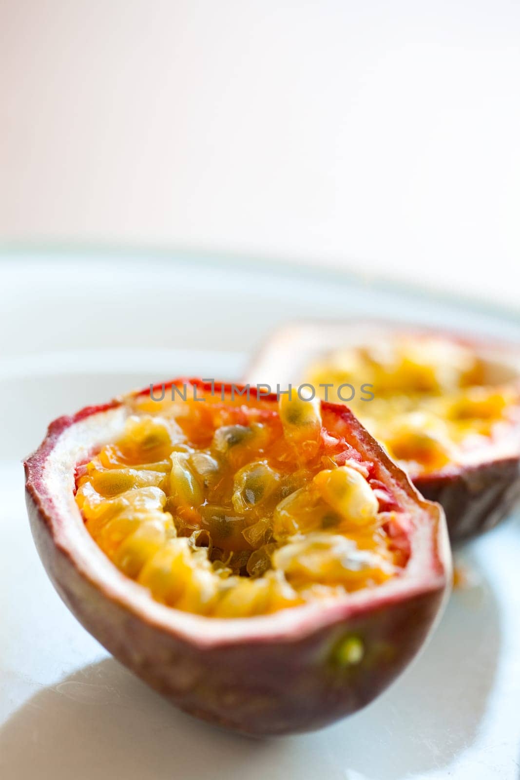 Delicious fresh passion fruit halves. Studio shot.