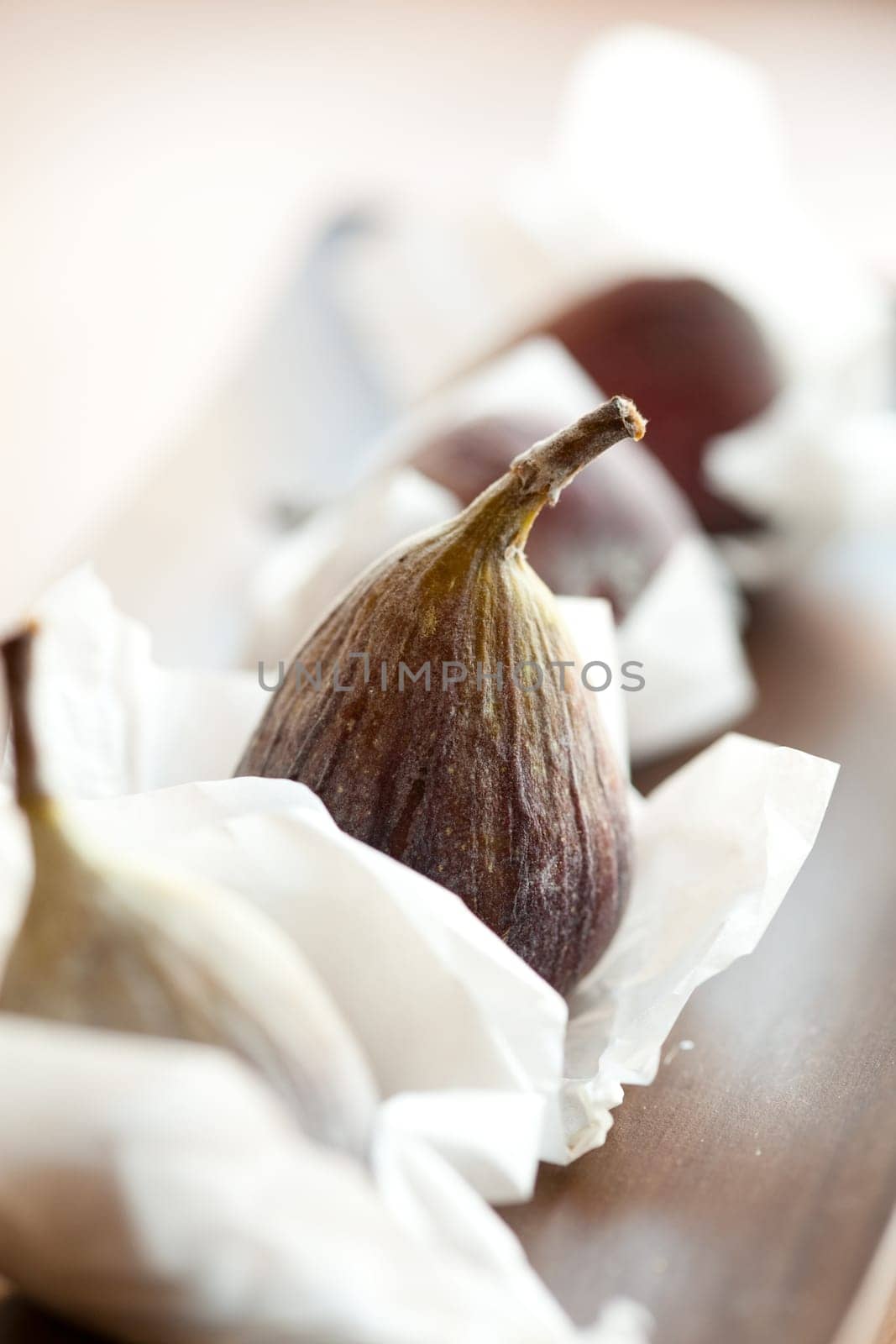 Delicious fresh figs on a wooden table. Studio shot.