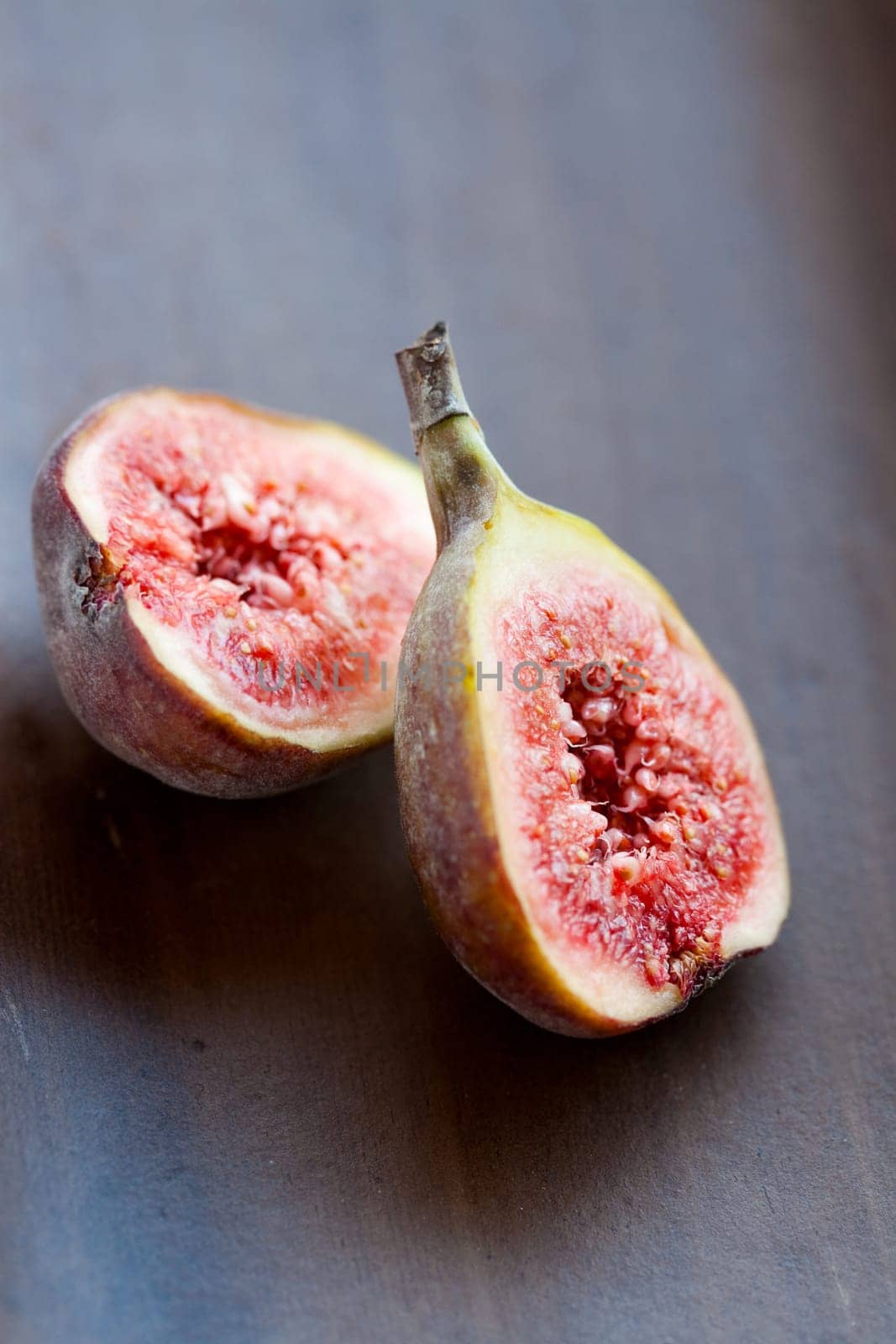 Delicious, fresh and ripe fig halves. Studio shot.