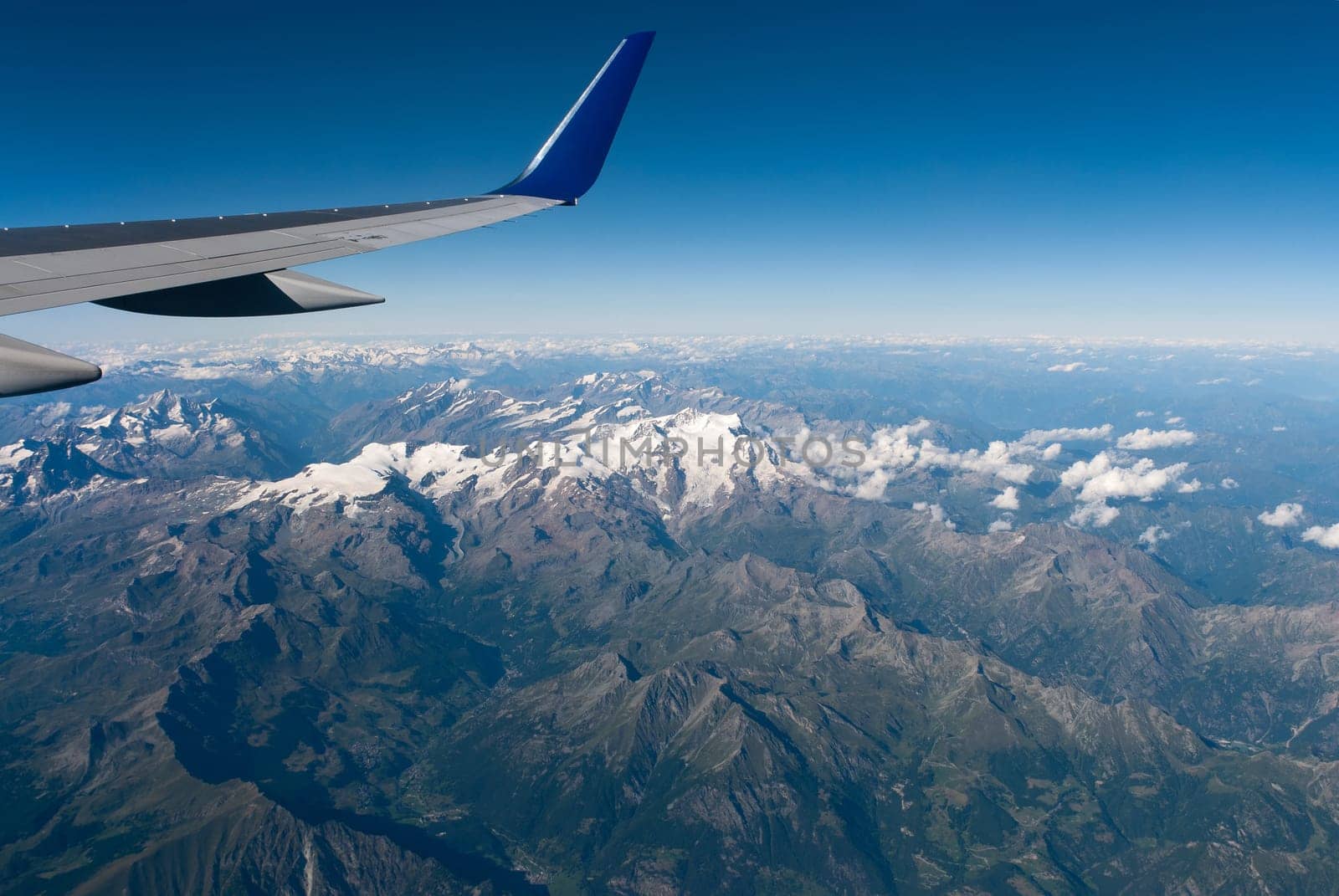 alps between switzerland and italy seen from the plane