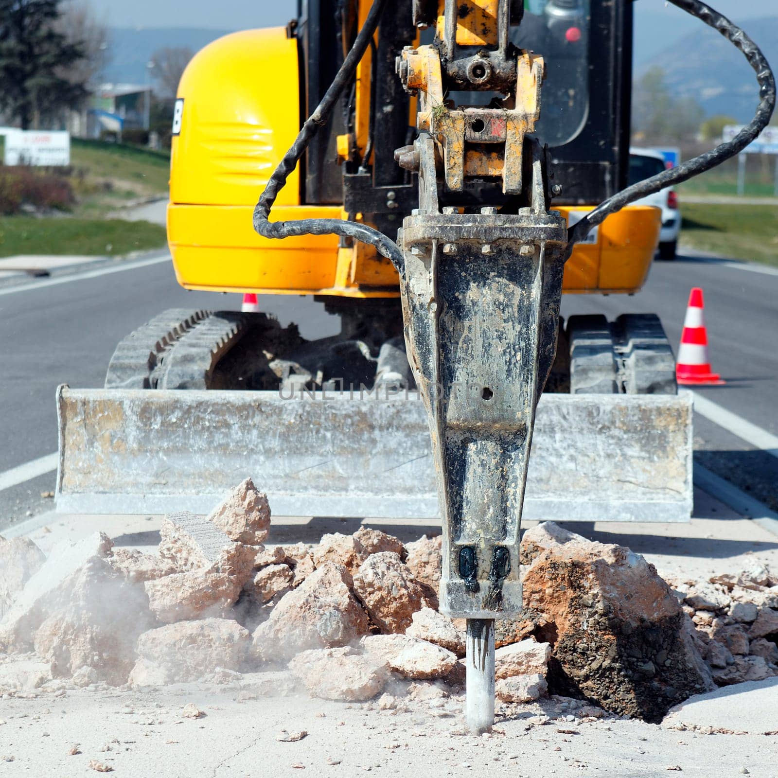 yellow jackhammer on building site in summer