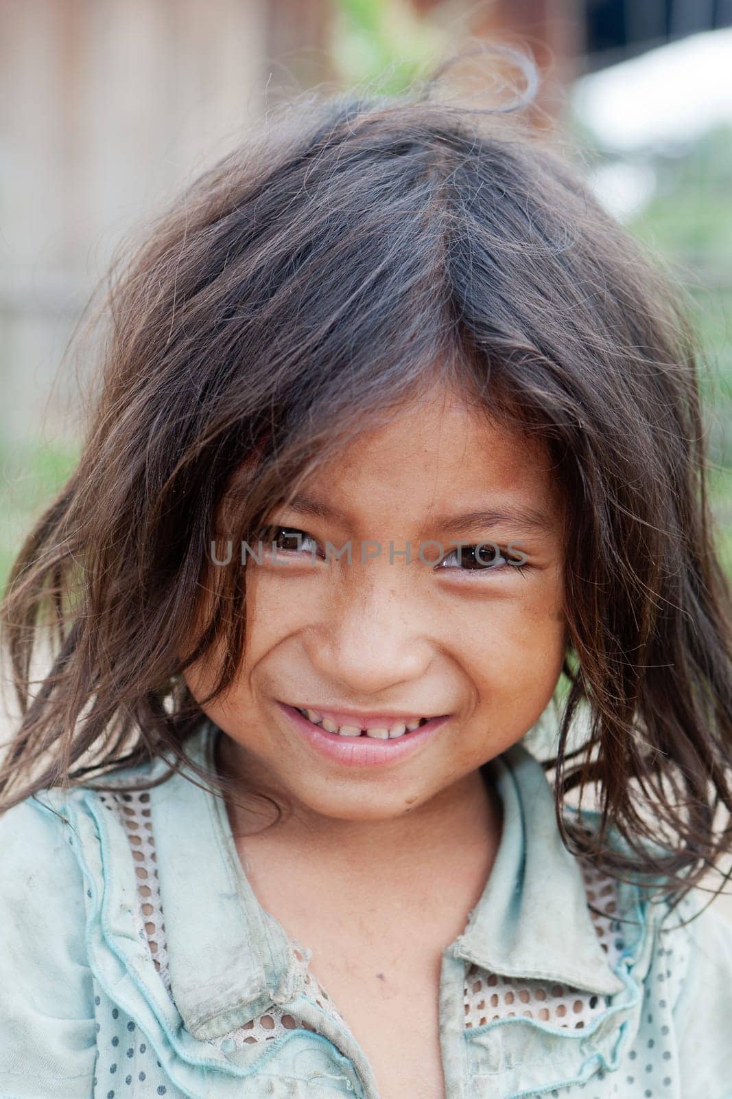 Portrait of asian girl,child with dirty clothes in poverty