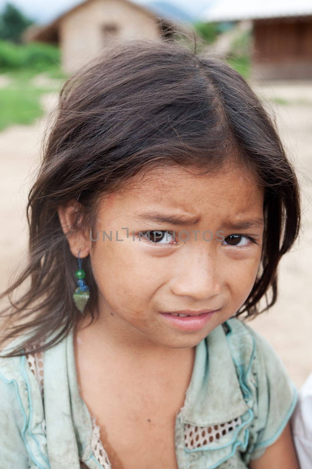 Portrait of asian girl,child with dirty clothes in poverty