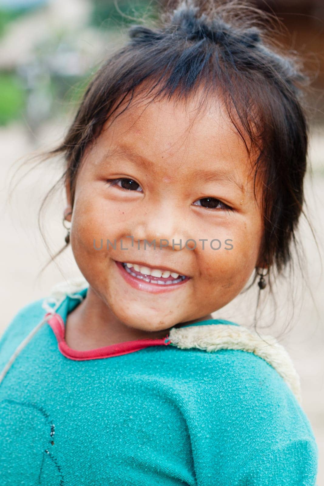 Portrait of asian girl,child with old clothes and dirty face