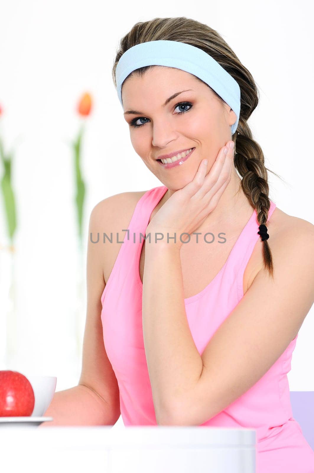 pretty woman in active clothed is smiling