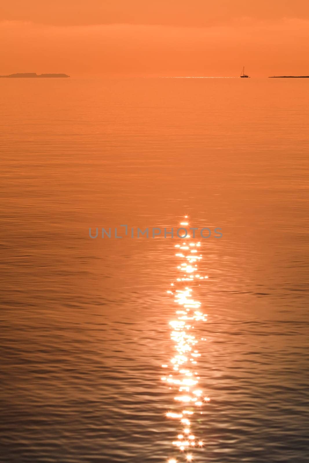 reflection of the sun at sunrise on sea