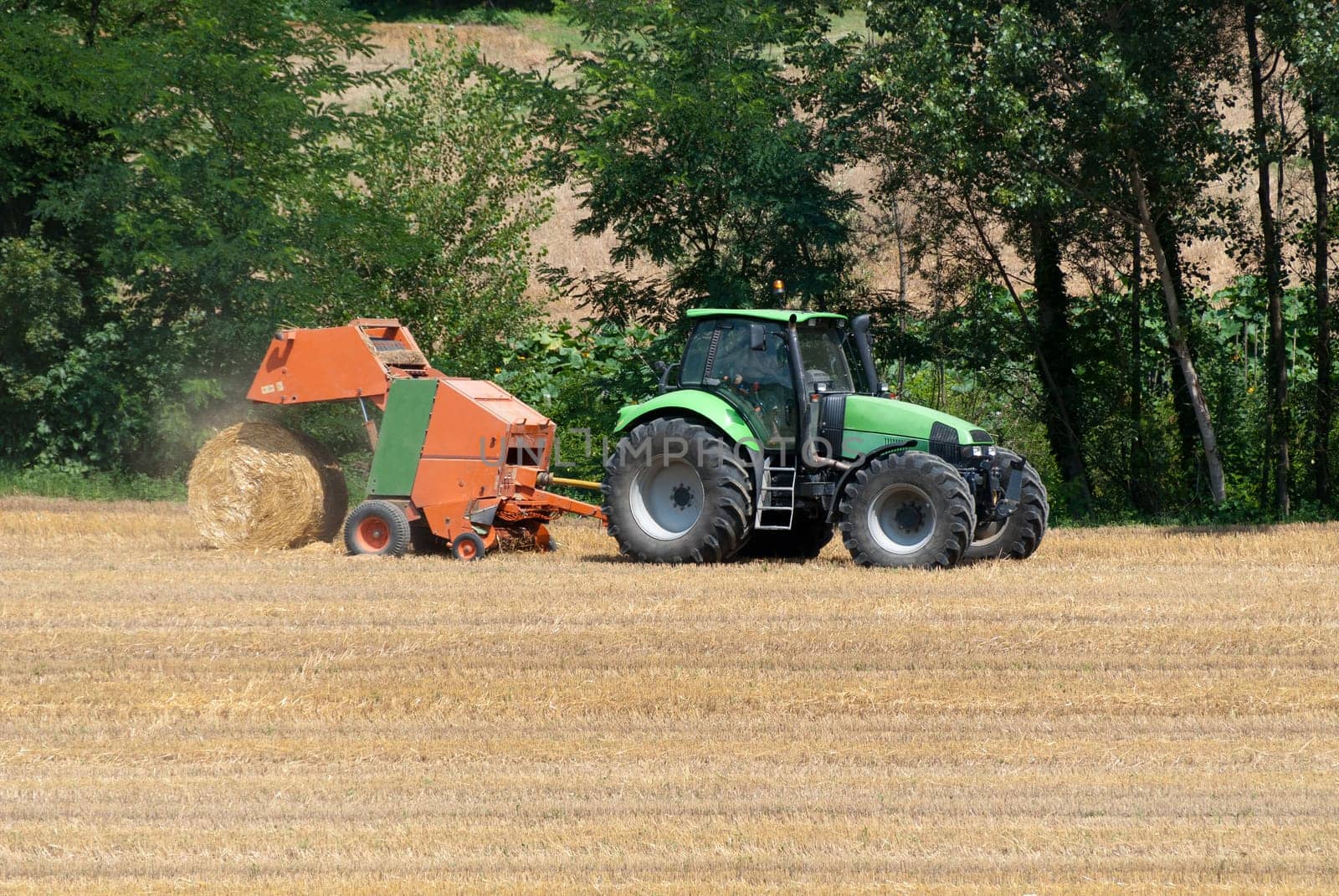 tractor with hay bales to catch the