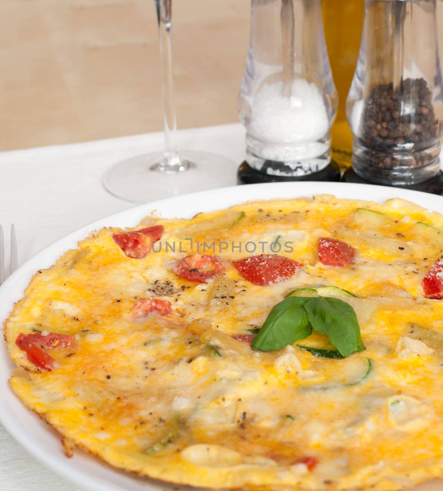 Egg Omelette With Tomatoes and Basil on the Table