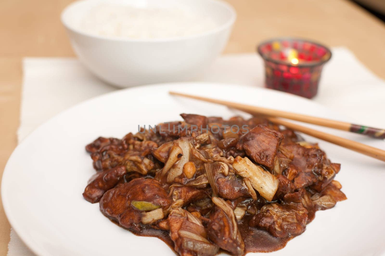 Kung Pao - chinese food with rice and chop sticks
