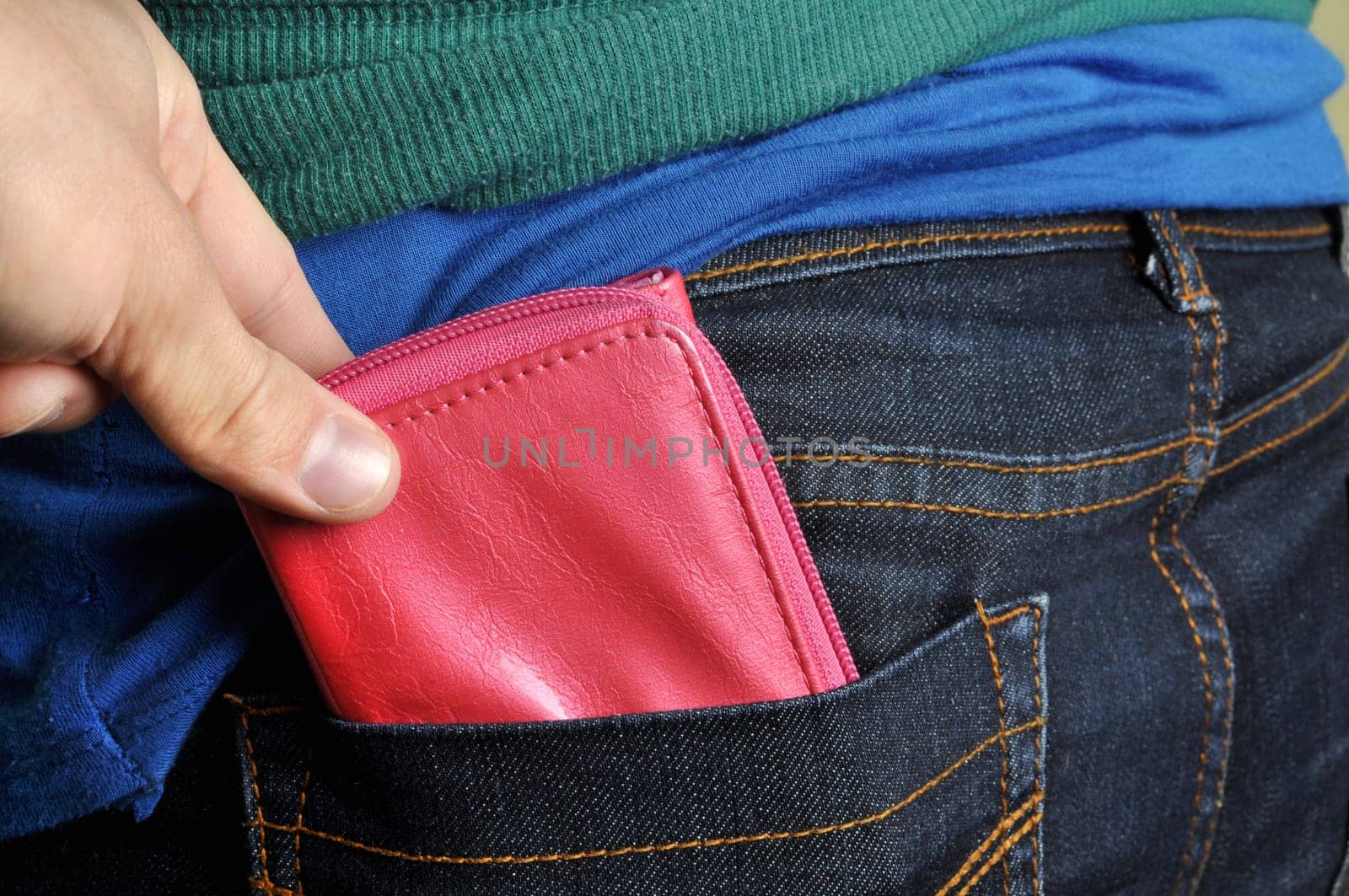 a pickpocket is trying to steal a wallet.
